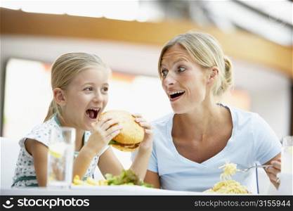 Mother And Daughter Having Lunch Together At The Mall