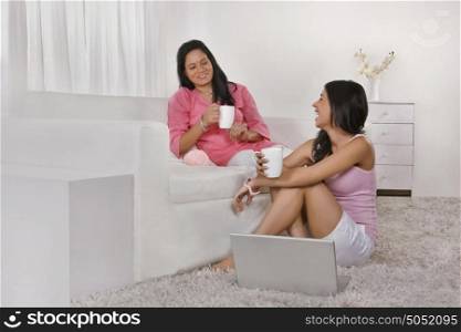 Mother and daughter having tea
