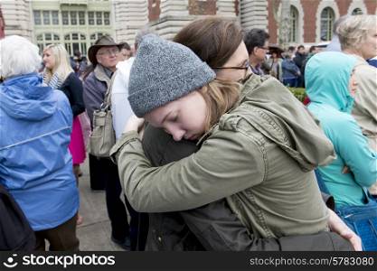 Mother and daughter hugging, Ellis Island, Jersey City, New York State, USA