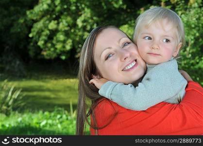 Mother and daughter hugging outdoor