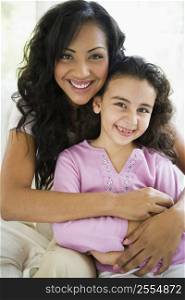 Mother and daughter in living room smiling (high key)