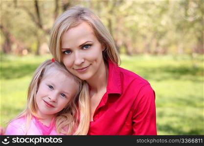 Mother and daughter in park in spring