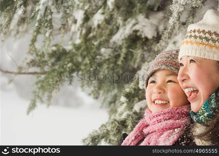 Mother and daughter in snow