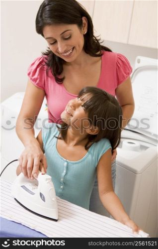 Mother And Daughter Ironing