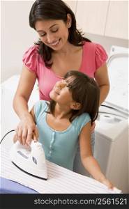 Mother And Daughter Ironing