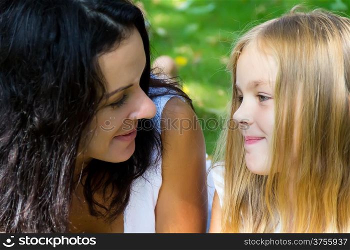 Mother and daughter looking to each others