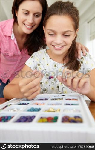 Mother and daughter making jewellery