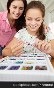 Mother and daughter making jewellery