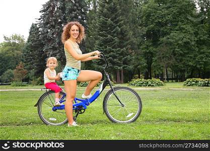 Mother and daughter on bicycle