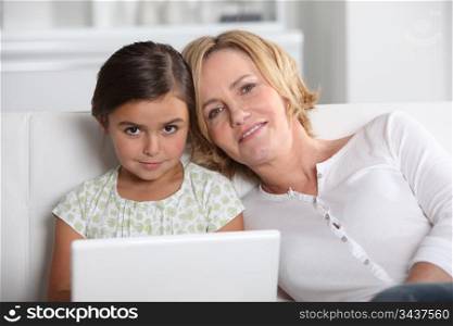 Mother and daughter on laptop