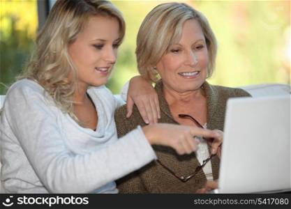 Mother and daughter on the computer