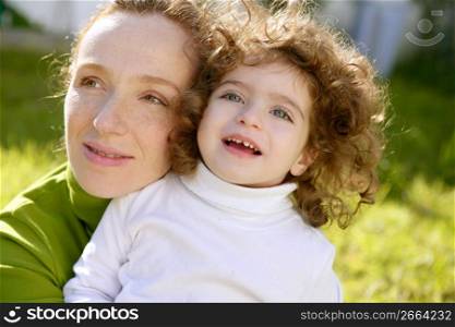 mother and daughter outdoor park green grass together