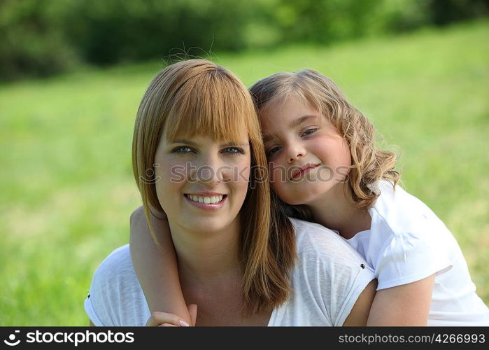 Mother and daughter outdoors