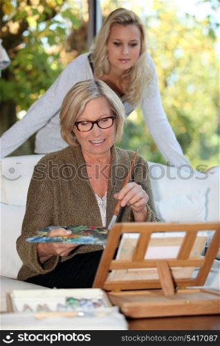 Mother and daughter painting