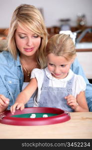 Mother and daughter playing a game