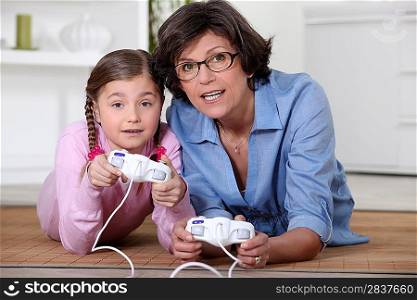 Mother and daughter playing video games