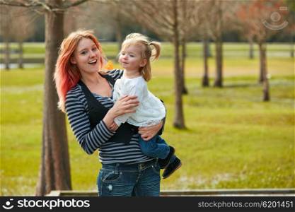 Mother and daughter playint together in the park
