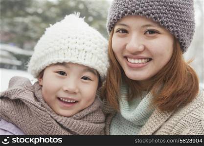 Mother and daughter portrait in winter