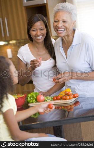 Mother And Daughter Preparing meal,mealtime Together