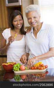 Mother And Daughter Preparing meal,mealtime Together