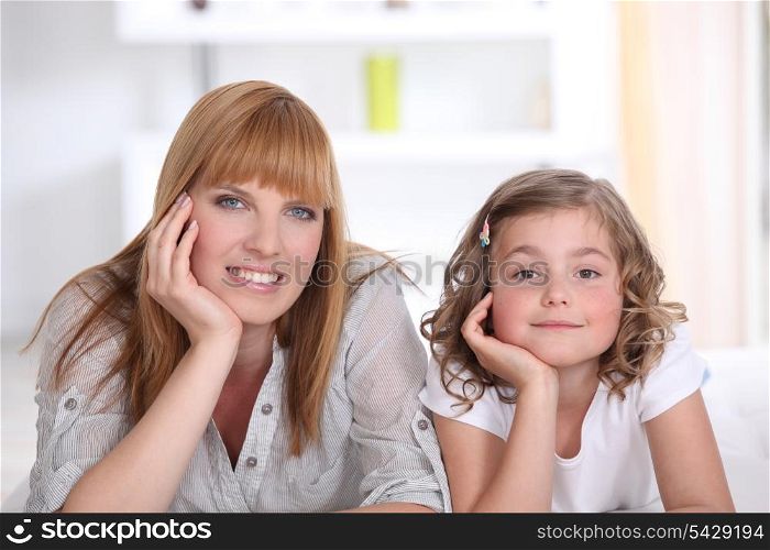 Mother and daughter relaxing at home