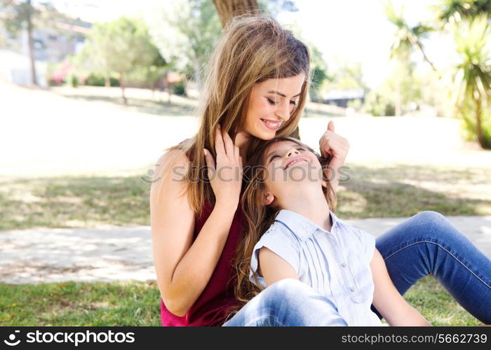 Mother and daughter relaxing in the city park