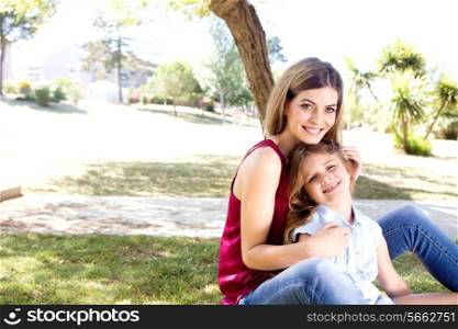 Mother and daughter relaxing in the city park