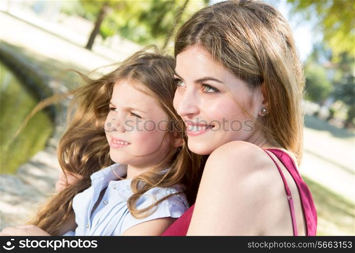Mother and daughter relaxing in the city park