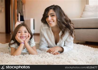 Mother and daughter relaxing together at home