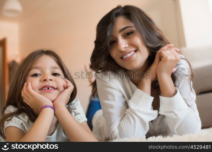 Mother and daughter relaxing together at home