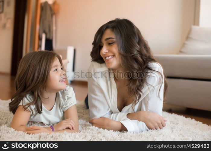 Mother and daughter relaxing together at home