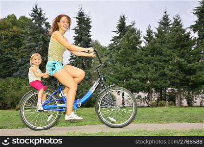 Mother and daughter ride on bicycle 2