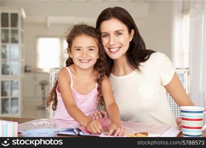 Mother and daughter scrapbooking