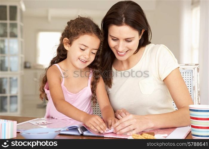 Mother and daughter scrapbooking