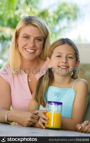 Mother and Daughter Sitting on Patio