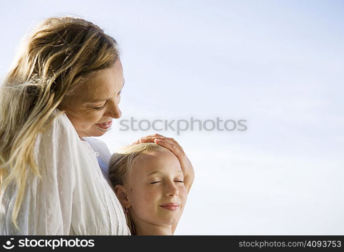 Mother and daughter sitting together