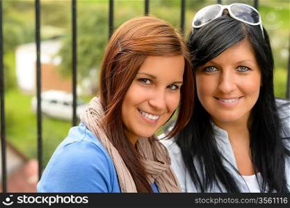 Mother and daughter smiling relaxing and bonding together comfortable teen