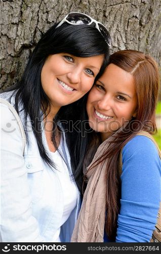 Mother and daughter spending time together park happy teen loving