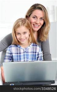 Mother and daughter surfing on internet