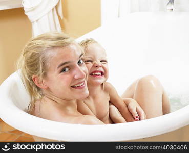 Mother and daughter taking a bath