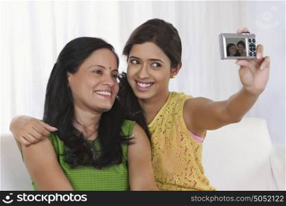Mother and daughter taking a self portrait