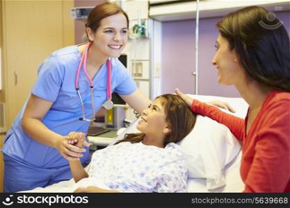 Mother And Daughter Talking To Female Nurse In Hospital Room