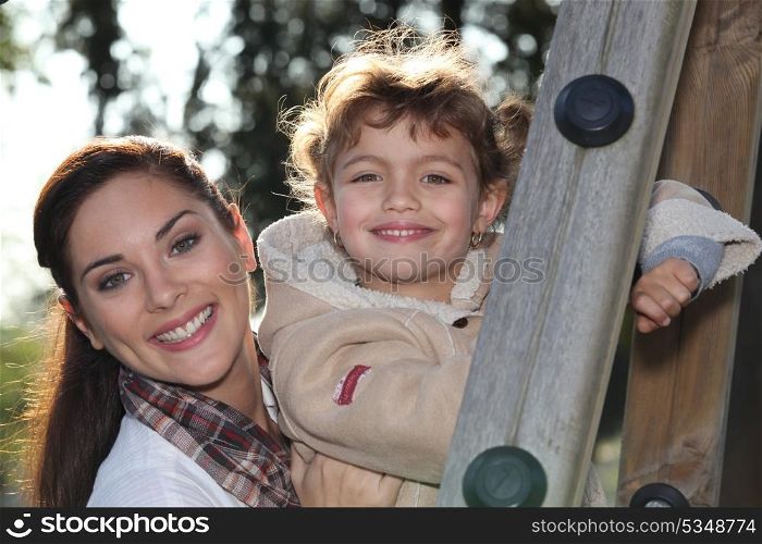 mother and daughter together in the playground