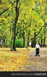 mother and daughter walking in park