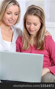 Mother and daughter websurfing on internet