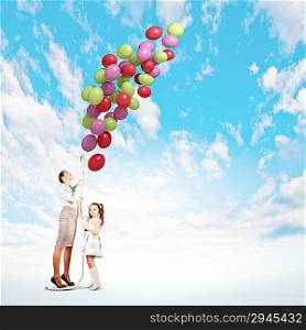 Mother and daughter with balloons