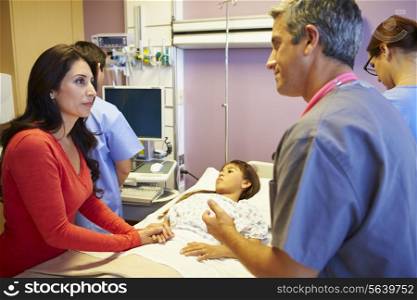 Mother And Daughter With Medical Staff In Hospital Room