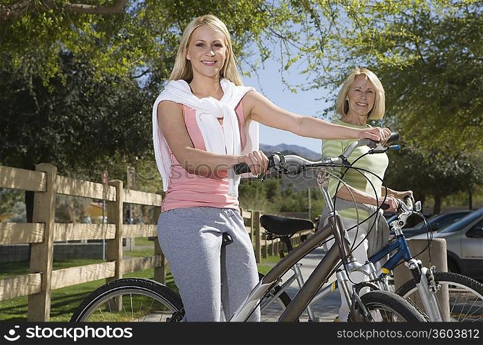 Mother and daughter with mountain bikes