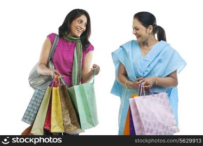 Mother and daughter with shopping bags