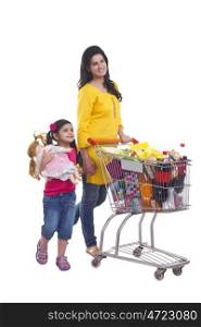 Mother and daughter with shopping cart